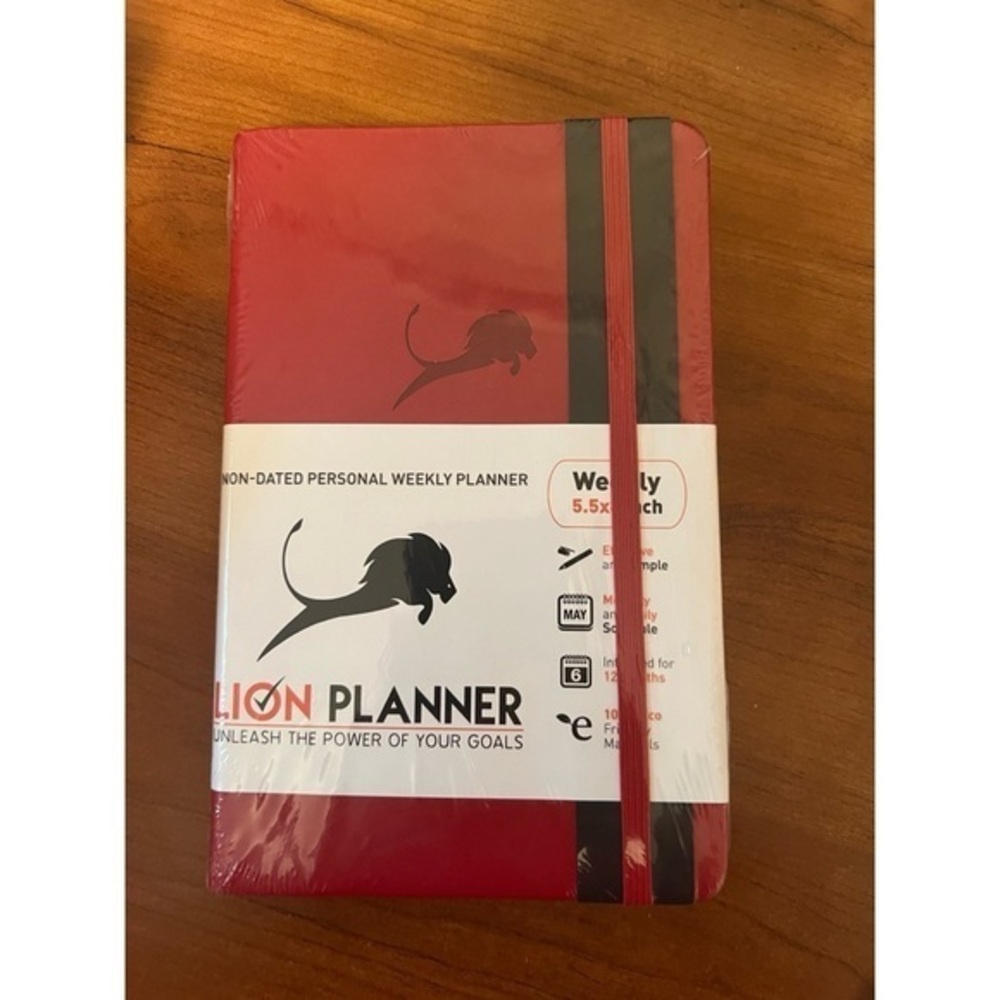 Red 5.5" x 8.5" Undated LION PLANNER New in package. Daily, weekly, monthly.